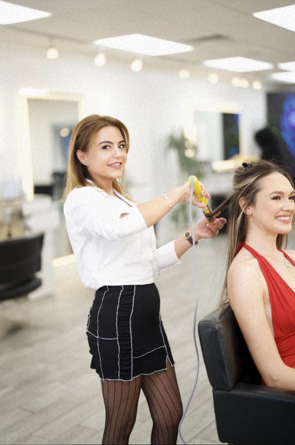 Nardeen styling a client at Nardeen Atelier